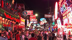 Neon-lit nightlife scene on Walking Street in Pattaya, Thailand, with crowds, bars, and entertainment venues buzzing after dark.
