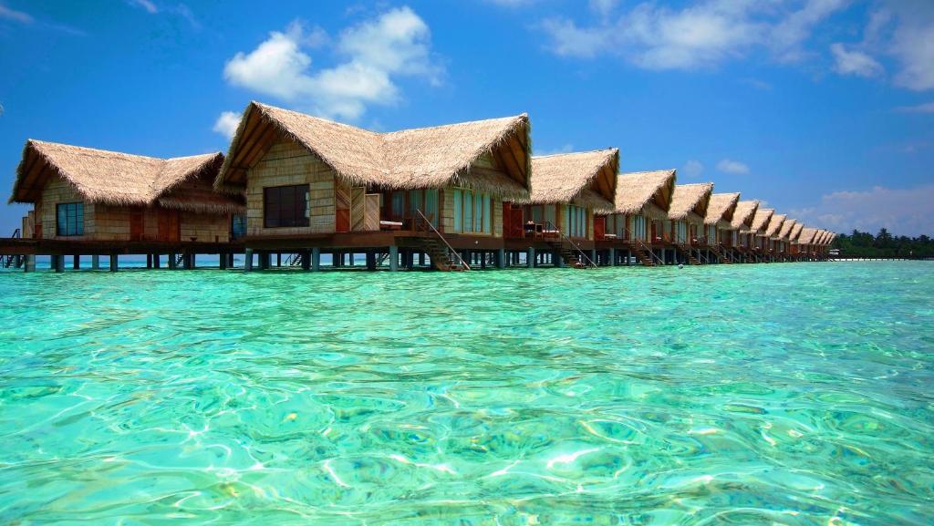 Aerial view of Adaaran Select Hudhuranfushi resort in Maldives with beachfront villas and turquoise waters