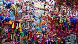 Bustling stalls and shoppers at Chatuchak Weekend Market in Bangkok.